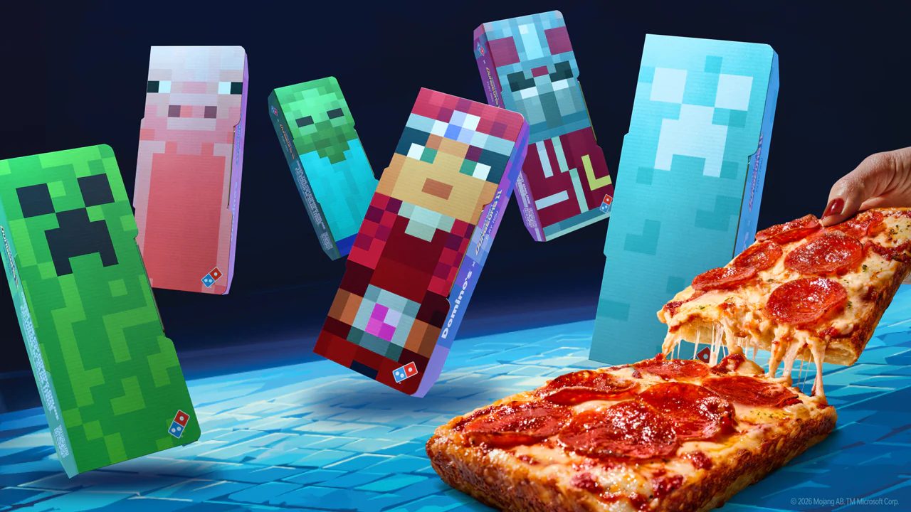 The six collectible Domino’s x Minecraft Dungeons II pizza boxes next to a Detroit-style Domino™ pizza